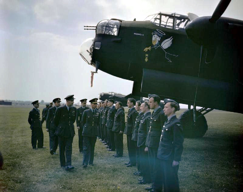 King George VI visiting men of No. 617 Squadron RAF at Scampton, England, United Kingdom, 27 May 1943; note Lancaster B Mk I bomber 'Frederick III'.jpg