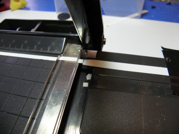 Cutting the gills from thin plastic using a stamp collector's mount guillotine